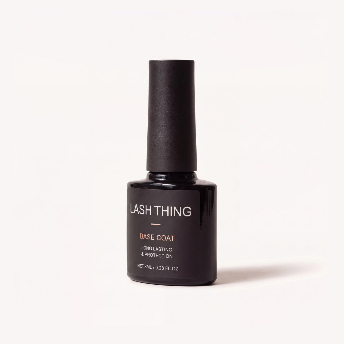 Lashthing Nail Basecoat 8 ml, zwart flesje met roségouden BASE COAT-label, schuin vooraanzicht